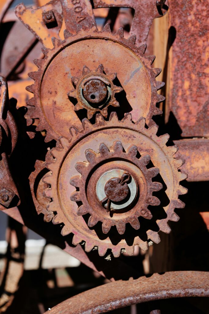Detailed shot of rusty industrial gears showcasing aging machinery and wear.