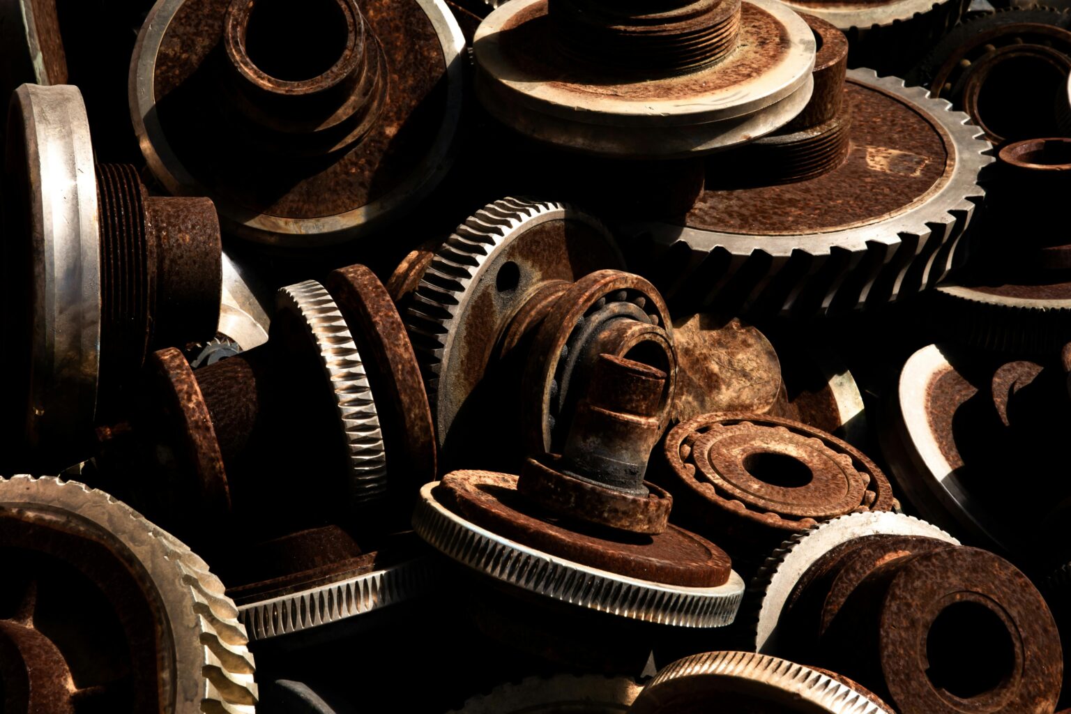 Detailed close-up of rusty industrial gears showcasing texture and metal wear.